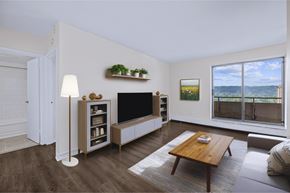 Hamilton apartment for rent - A living room with a wooden floor and a large window.