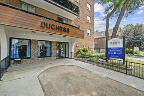Hamilton apartment for rent - The entrance to the Duchess building with a signboard in front.