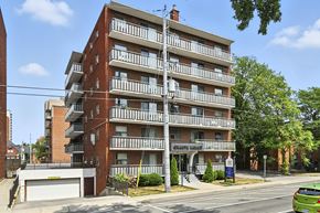 Hamilton apartment for rent - A multi-story apartment building with a balcony on each floor.