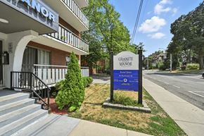 Hamilton apartment for rent - A sign for Granite Manor Apartments stands in front of a building entrance.