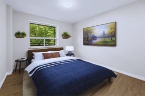 Dundas apartment for rent - A bedroom with a large bed and a painting on the wall.