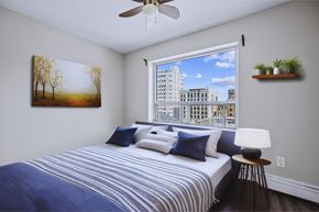 Hamilton apartment for rent - A bedroom with a large bed and a painting on the wall.