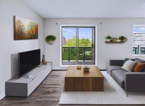 Hamilton apartment for rent - A modern living room with a flat screen TV, a grey sofa, and a wooden coffee table.