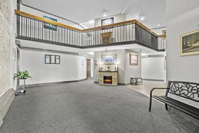 Hamilton apartment for rent - A living room with a fireplace and a balcony.