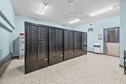 Hamilton apartment for rent - A row of black lockers in a room with a white floor.