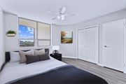 Hamilton apartment for rent - A bedroom with a large bed and a ceiling fan.
