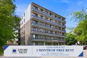 Hamilton apartment for rent - A building with a sign offering 1 month of free rent.