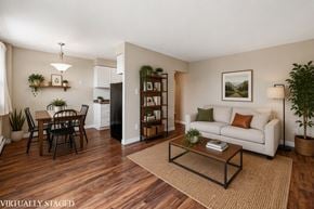 Hamilton apartment for rent - A living room with a couch, a dining table, and a coffee table.