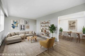 Hamilton apartment for rent - A living room with a couch, a chair, a coffee table, and a bookshelf.