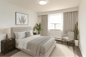 Hamilton apartment for rent - A bedroom with a large bed, a chair, and a potted plant.