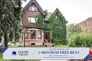 Hamilton apartment for rent - A house with a sign offering 1 month of free rent.