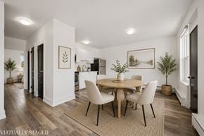 Kitchener apartment for rent - A dining room with a round table and chairs.