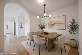 Kitchener apartment for rent - A dining room with a wooden table and chairs.