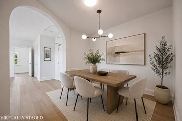 Kitchener apartment for rent - A dining room with a wooden table and chairs.