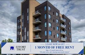 Kitchener apartment for rent - A large building with a sign that says "Effort Trust 1 Month of Free Rent".
