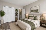 Hamilton apartment for rent - A bedroom with a bed, nightstands, and a painting on the wall.