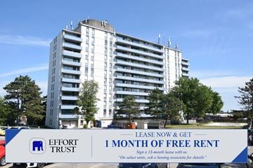 St. Catharines apartment for rent - A large white building with a sign in front that says "Effort Trust 1 Month of Free Rent".