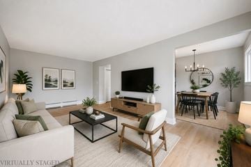 Waterloo apartment for rent - A living room with a couch, coffee table, and television.