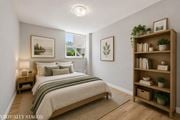 Hamilton apartment for rent - A bedroom with a bed, nightstand, and a bookshelf.