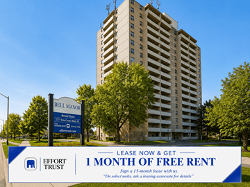 Hamilton apartment for rent - A tall building with a sign in front that says "Bell Manor" and "1 month of free rent".