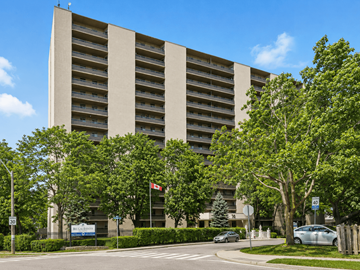 Hamilton apartment for rent - A large building with a lot of windows and trees in front.