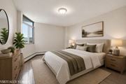 Hamilton apartment for rent - A bedroom with a large bed, a mirror, and a painting on the wall.