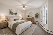 Hamilton apartment for rent - A bedroom with a bed, nightstands, and a ceiling fan.