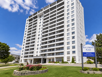 Hamilton apartment for rent - A tall white building with a blue sign in front that says Ben Lomond Plaza.
