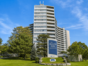Hamilton apartment for rent - A tall building with a sign that says "The Beverly Hills Apartments".