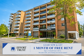 Hamilton apartment for rent - A tall apartment building with a sign offering 1 month free rent.