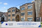 Kitchener apartment for rent - A sign advertises 2 months of free rent at a brick building.