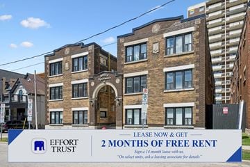 Kitchener apartment for rent - A sign advertises 2 months of free rent at a brick building.