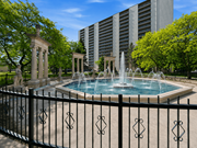 Hamilton apartment for rent - A fountain in the middle of a pool surrounded by a black fence.