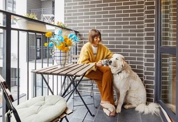 A woman with a white dog