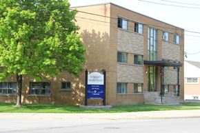Hamilton apartment for rent - A brick building with a sign that says Whiskey Mercure.