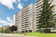 Hamilton apartment for rent - A tall building with the words "Westhills Towers" on the front.