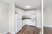 Hamilton apartment for rent - A kitchen with white appliances and cabinets.