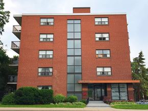 Hamilton apartment for rent - A red brick building with a glass entrance and a sign that says Westward.
