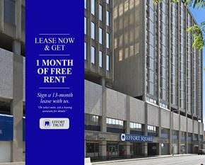 Hamilton apartment for rent - large blue sign offering a free month of rent for signing a 13-month lease.