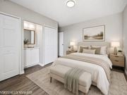 Hamilton apartment for rent - A bedroom with a large bed and a painting on the wall.