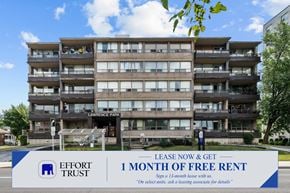 Hamilton apartment for rent - A multi-story apartment building with a sign offering a free month of rent for 13-month leases.