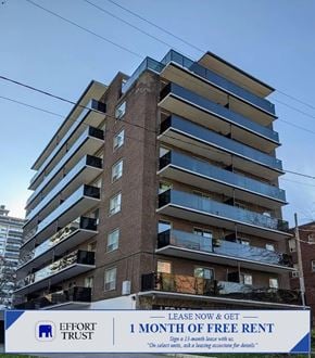 Hamilton apartment for rent - A tall building with a sign that says "Effort Trust 1 month of free rent".