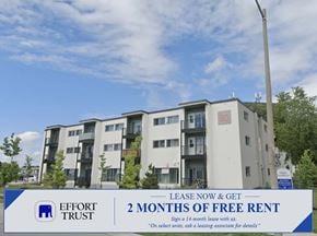 Kitchener apartment for rent - A building with a sign offering 2 months of free rent.