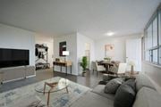 Hamilton apartment for rent - A living room with a grey couch and a glass coffee table.