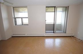 Hamilton apartment for rent - A room with a window and a sliding glass door.