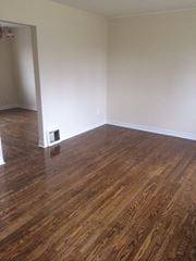 Cobourg apartment for rent - A room with wooden flooring and a white wall.