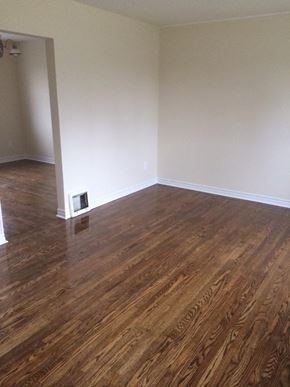 Cobourg apartment for rent - A room with wooden flooring and a white wall.