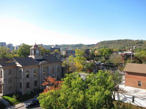 Dundas apartment for rent - A clock tower stands atop a building in a town.