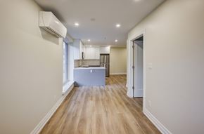 Hamilton apartment for rent - A long hallway with a kitchen at the end.