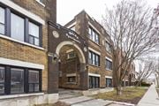 Kitchener apartment for rent - A brick building with a sign that says "West Side Apartments".
